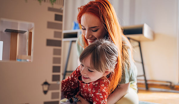 Woman hugging small child