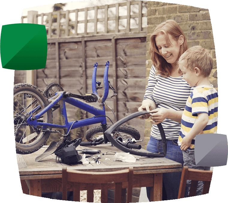 Mother and son fixing bicycle