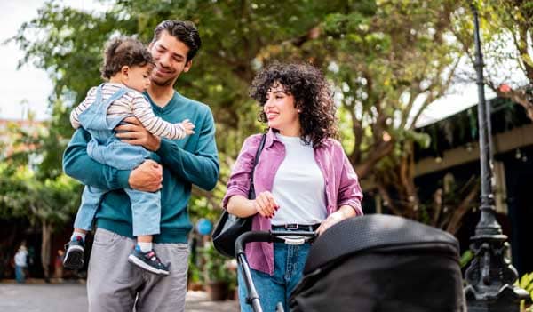 couple with toddler and pram