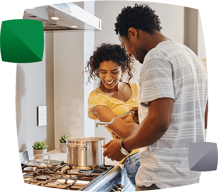 Couple cooking in kitchen